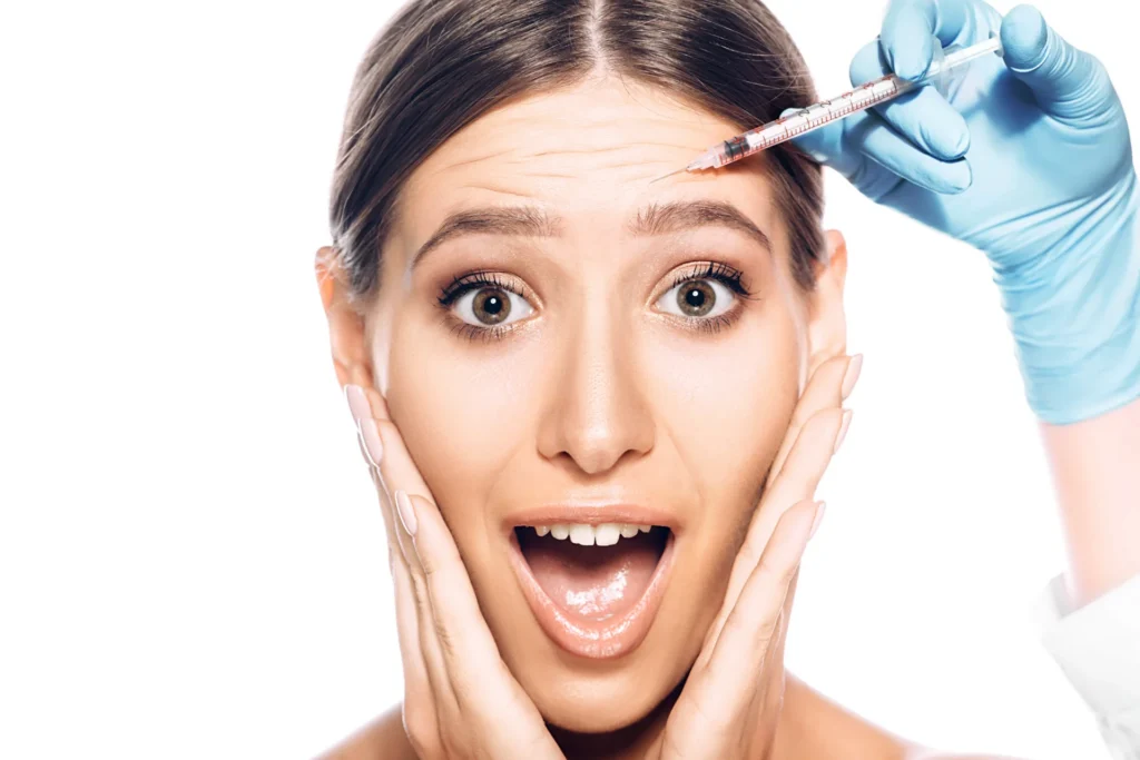 woman receives cosmetic injection with open mouth 2026 03 25 09 16 49 utc
